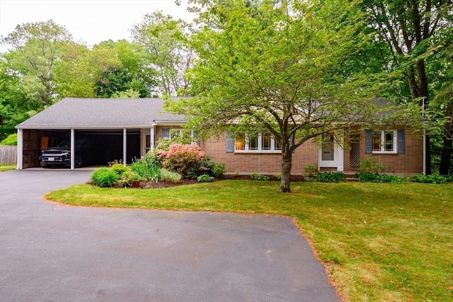 13 Smith Rd, Hingham, MA 02043 - view of front of home featuring a front lawn, driveway, brick siding, and an attached carport