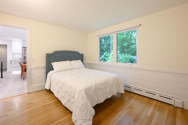 13 Smith Rd, Hingham, MA 02043 - bedroom with baseboard heating, light wood finished floors, and wainscoting