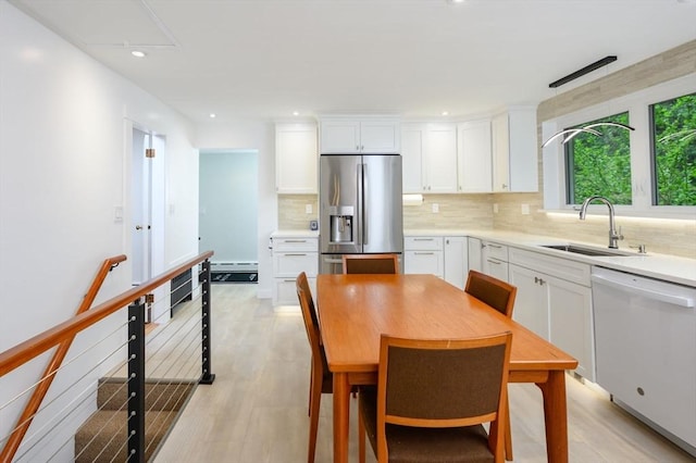 13 Smith Rd, Hingham, MA 02043 - kitchen with stainless steel refrigerator with ice dispenser, dishwasher, a sink, tasteful backsplash, and white cabinetry