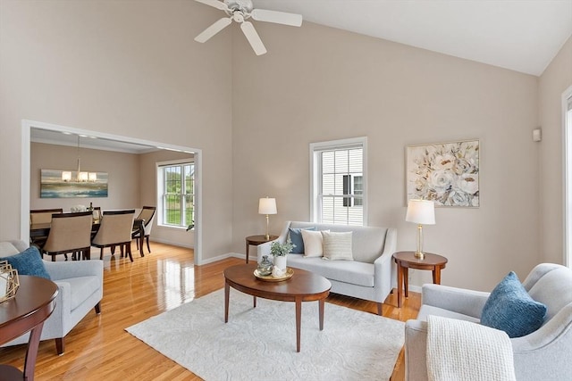 45 Augusta Way Unit 23, Chelmsford, MA 01863 - living area featuring high vaulted ceiling, light wood finished floors, baseboards, ceiling fan, and a chandelier