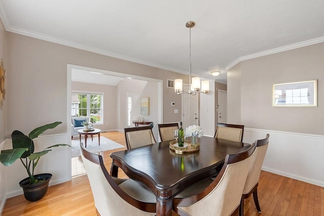 45 Augusta Way Unit 23, Chelmsford, MA 01863 - dining room with light wood-style floors, a chandelier, crown molding, and baseboards