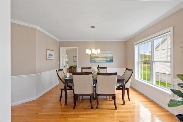 45 Augusta Way Unit 23, Chelmsford, MA 01863 - dining area featuring light wood finished floors, baseboards, a chandelier, and crown molding
