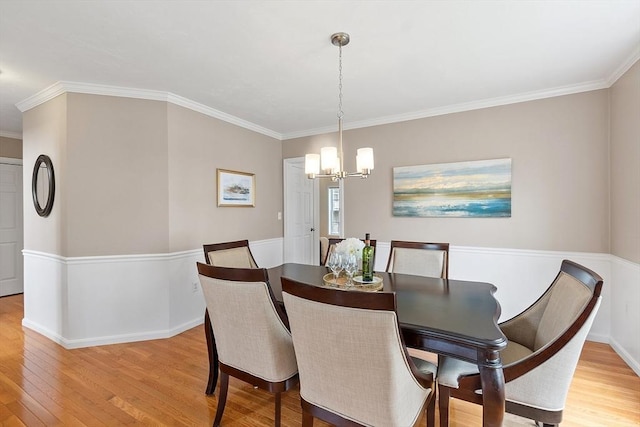 45 Augusta Way Unit 23, Chelmsford, MA 01863 - dining area with a chandelier, light wood finished floors, ornamental molding, and baseboards