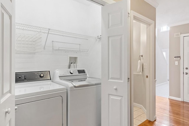 45 Augusta Way Unit 23, Chelmsford, MA 01863 - clothes washing area with separate washer and dryer, light wood-style floors, ornamental molding, and baseboards