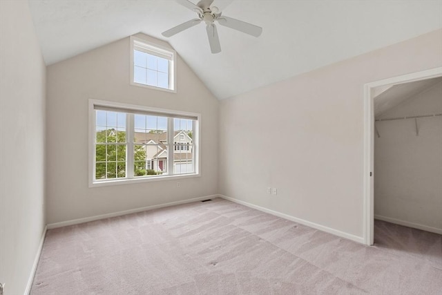 45 Augusta Way Unit 23, Chelmsford, MA 01863 - unfurnished bedroom with light colored carpet, a spacious closet, baseboards, a ceiling fan, and high vaulted ceiling