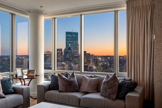 living area featuring a city view and ornamental molding