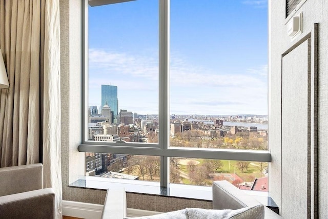 sitting room featuring a city view and plenty of natural light