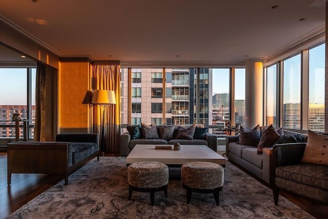 sitting room with ornamental molding, wood finished floors, and floor to ceiling windows