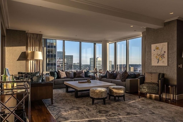 living area with wood finished floors, expansive windows, and a view of city