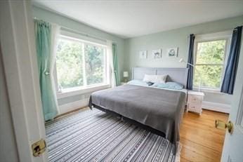 bedroom with baseboards and light wood-style floors