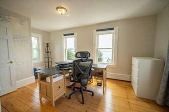 home office featuring light wood-style floors and baseboards