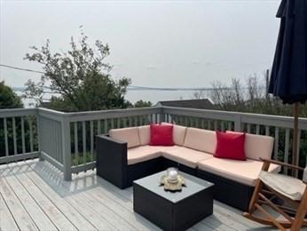 wooden deck featuring outdoor lounge area