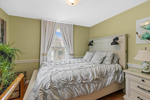 bedroom featuring dark wood-style flooring