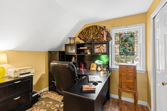 office area with lofted ceiling, dark wood-style flooring, and baseboards