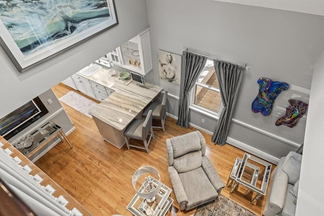 interior space featuring baseboards and wood finished floors