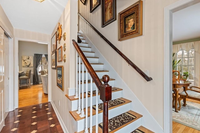 staircase featuring wood finished floors