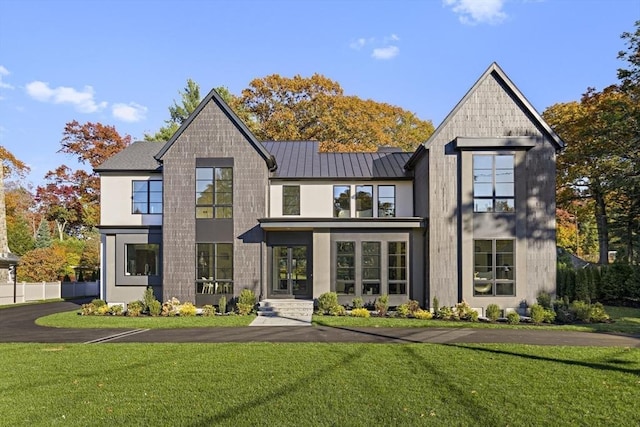 modern farmhouse with a front lawn