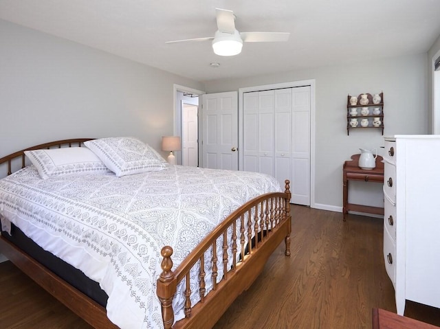 bedroom with baseboards, a closet, dark wood-style flooring, and ceiling fan