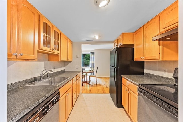 374 Great Rd Unit 10, Acton, MA 01720 - kitchen featuring black appliances, under cabinet range hood, dark countertops, glass insert cabinets, and a sink