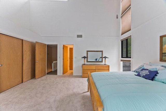 374 Great Rd Unit 10, Acton, MA 01720 - carpeted bedroom with radiator heating unit and a high ceiling