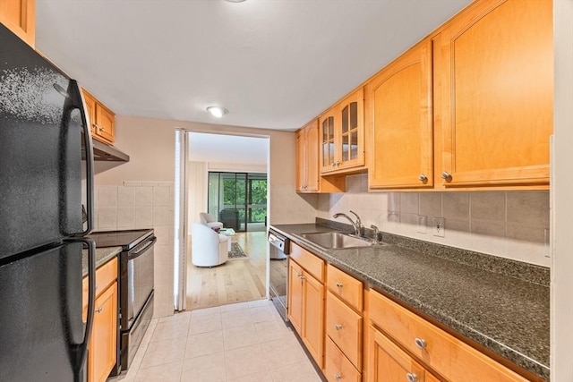 374 Great Rd Unit 10, Acton, MA 01720 - kitchen featuring black appliances, a sink, dark countertops, under cabinet range hood, and light tile patterned flooring