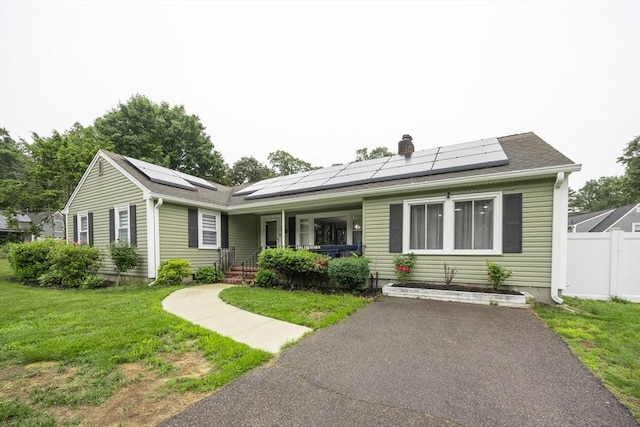 109 Circle Dr, Wrentham, MA 02093 - view of front of house with a porch, solar panels, and a chimney