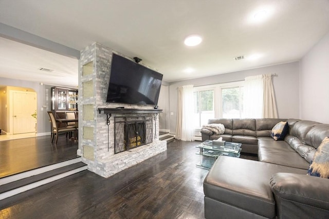 109 Circle Dr, Wrentham, MA 02093 - living area with dark wood-type flooring and a fireplace