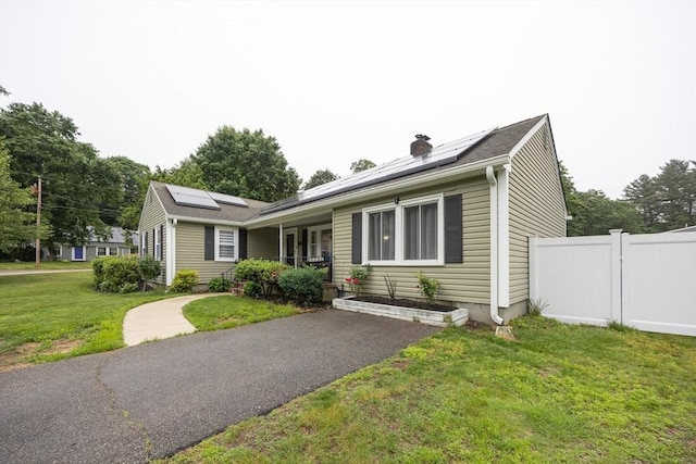 109 Circle Dr, Wrentham, MA 02093 - ranch-style house featuring roof mounted solar panels, a porch, and a chimney