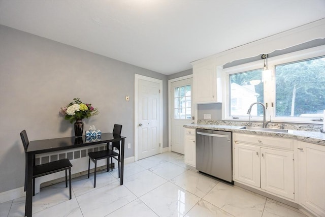 109 Circle Dr, Wrentham, MA 02093 - kitchen with dishwasher, light marble finish floors, light stone counters, white cabinetry, and radiator