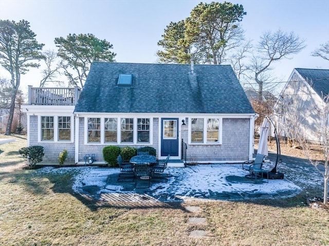 rear view of house with a patio area and a yard