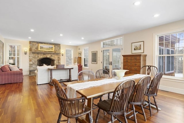 dining space featuring recessed lighting, french doors, and wood finished floors