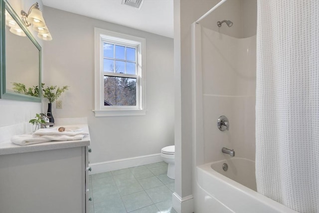 full bath featuring tile patterned flooring, vanity, toilet, baseboards, and shower / tub combo