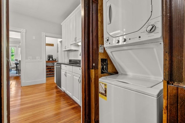 17 Park Vale Unit 2, Brookline, MA 02446 - washroom with stacked washer / dryer and light wood-style floors