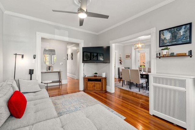 17 Park Vale Unit 2, Brookline, MA 02446 - living area featuring crown molding, wood finished floors, a ceiling fan, radiator, and baseboards