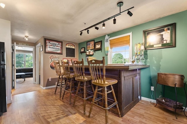 36 Porter Rd, Marlborough, MA 01752 - indoor dry bar with wood finished floors and rail lighting