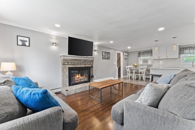 36 Porter Rd, Marlborough, MA 01752 - living area with ornamental molding, recessed lighting, wood finished floors, baseboard heating, and a tile fireplace