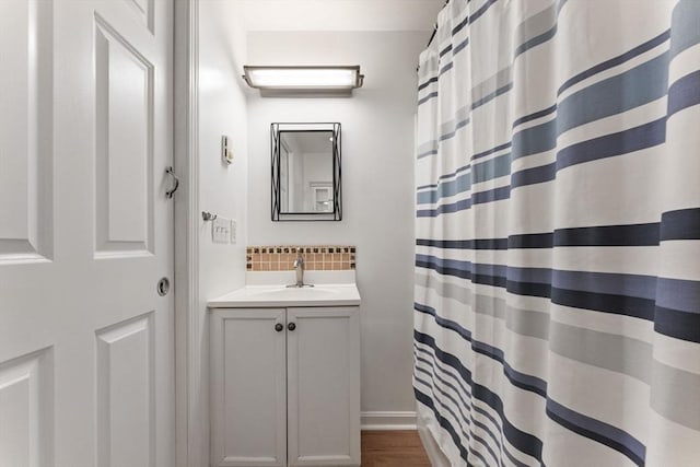 36 Porter Rd, Marlborough, MA 01752 - full bath featuring decorative backsplash, vanity, and a shower with curtain