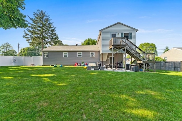 36 Porter Rd, Marlborough, MA 01752 - rear view of house with a fenced backyard, stairway, a patio area, and an outdoor hangout area