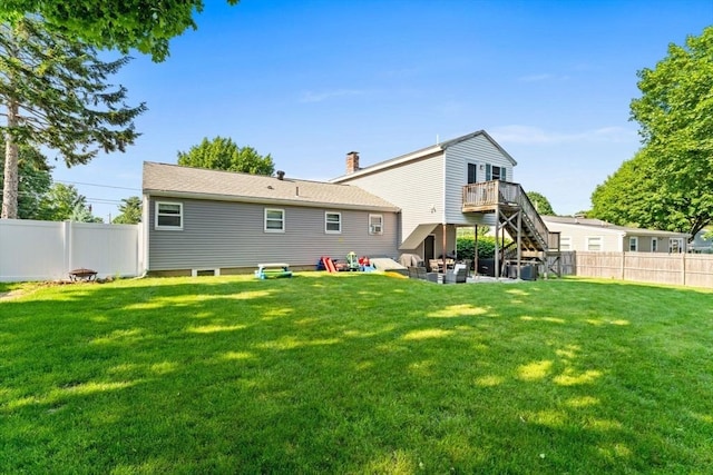 36 Porter Rd, Marlborough, MA 01752 - rear view of house with stairway, a fenced backyard, a chimney, and a patio
