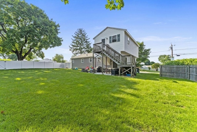 36 Porter Rd, Marlborough, MA 01752 - back of property featuring a fenced backyard, stairs, a deck, and a patio