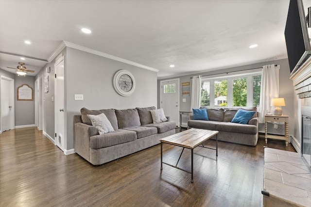 36 Porter Rd, Marlborough, MA 01752 - living room with dark wood-style floors, ornamental molding, recessed lighting, a tile fireplace, and a ceiling fan