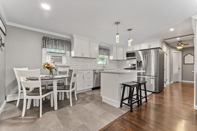 36 Porter Rd, Marlborough, MA 01752 - kitchen featuring appliances with stainless steel finishes, white cabinetry, backsplash, light countertops, and cooling unit