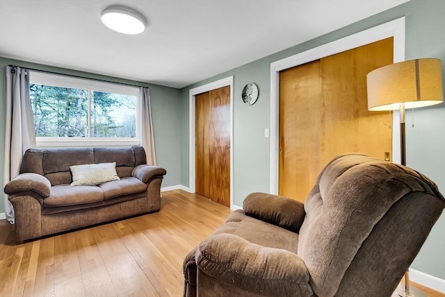 living area featuring wood finished floors and baseboards