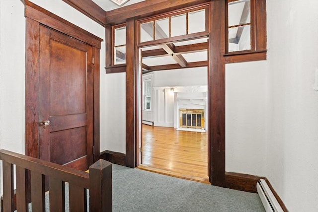 67-69 Nesmith St, Lawrence, MA 01841 - hallway featuring a baseboard radiator, carpet, and a baseboard heating unit