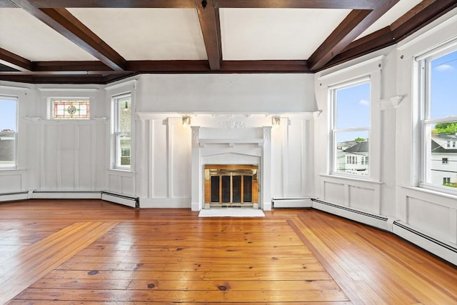 67-69 Nesmith St, Lawrence, MA 01841 - unfurnished living room featuring a decorative wall, hardwood / wood-style flooring, beamed ceiling, healthy amount of natural light, and coffered ceiling