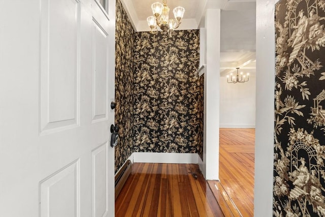 67-69 Nesmith St, Lawrence, MA 01841 - bathroom featuring a chandelier, a baseboard heating unit, and hardwood / wood-style floors