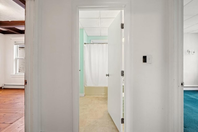 67-69 Nesmith St, Lawrence, MA 01841 - corridor featuring baseboard heating, a paneled ceiling, and beam ceiling
