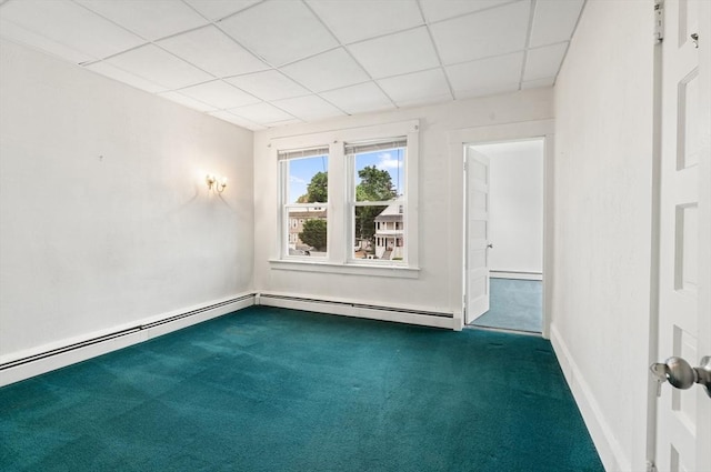 67-69 Nesmith St, Lawrence, MA 01841 - carpeted empty room with a paneled ceiling and a baseboard radiator