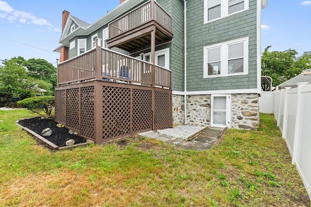 67-69 Nesmith St, Lawrence, MA 01841 - rear view of house with a balcony, a deck, and stone siding