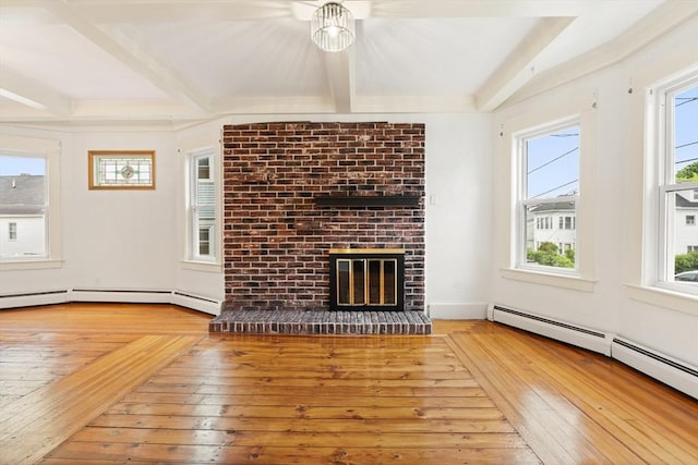 67-69 Nesmith St, Lawrence, MA 01841 - unfurnished living room with hardwood / wood-style floors, beamed ceiling, a fireplace, and a baseboard heating unit